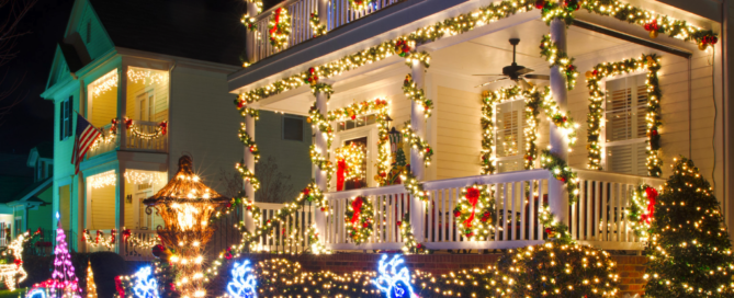 Festive holiday lights decorating a house with vibrant reindeer and garland, showcasing Mirasol Solar's energy-efficient holiday lighting solutions.